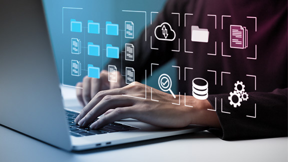 Key Feature: Scaling Hands on a laptop keyboard displaying digital icons