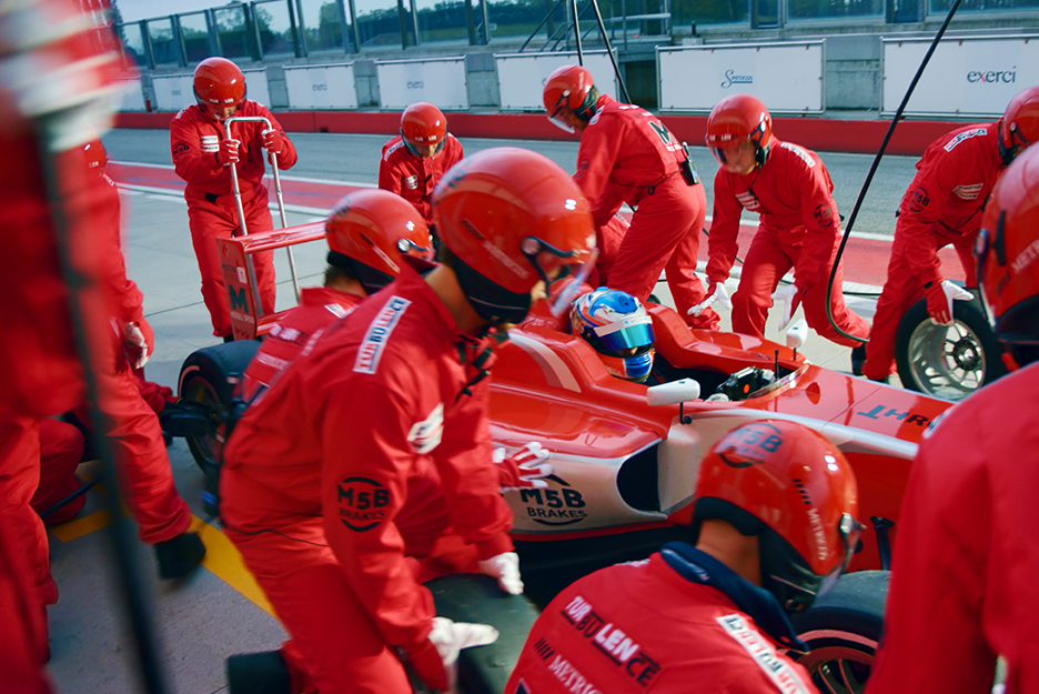 Image of a race car team